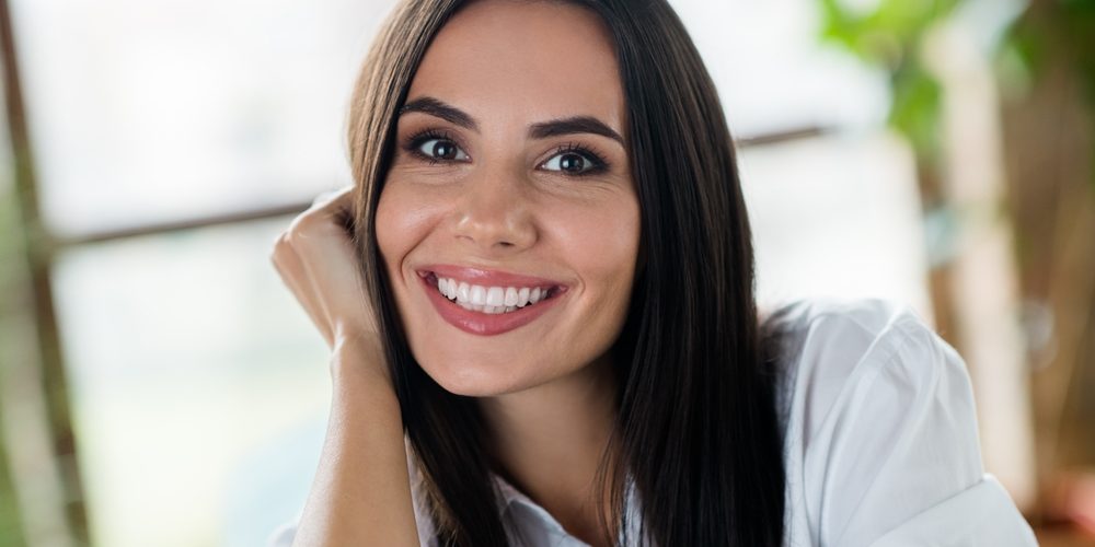 Portrait,Of,Adorable,Satisfied,Cheerful,Girl,Beaming,Smile,Arm,Touch general dentist near me